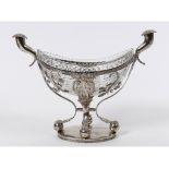 A late 19th century Continental silver coloured metal stand, with cornucopia handles and decorated