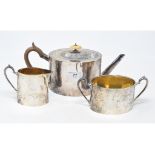 A George III style silver three piece tea set, the teapot with presentation inscription and dated