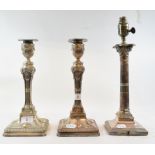 A pair of silver plated candlesticks, with embossed urn and swag decoration, the stems decorated