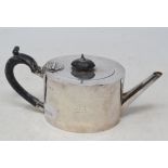 A late Victorian oval silver teapot, crested, London 1882, approx. 8.9 ozt (all in)