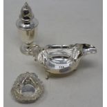 A silver sauce boat, Birmingham 1908, a silver sugar caster and a silver bon bon dish with pierced