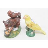 A 19th century porcelain canary, 9.5 cm high, and a Victorian porcelain box and cover, in the form