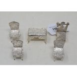 A set of three silver miniature chairs, in the Dutch taste, London 1900, another chair, and a