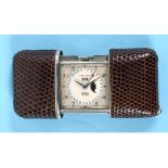 A 1930s nickel plated Movado purse watch, with phase of the moon, day, date and calendar, in a