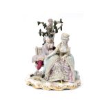 A late 19th century Meissen porcelain group, the proposal, the figures on a garden bench, by a