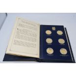 An album of silver gilt medallions, The Churchill Centenary Medals, Trustees Presentation Edition