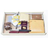 A 9ct gold thimble, cased, a silver thimble, stamped CH, cased, three fountain pens, an AA badge,