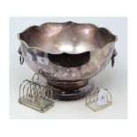 EXTRA LOT: Two silver toast racks, approx. 5.3 ozt, and a silver plated punch bowl, with a case (3)