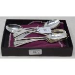 A set of twelve silver old English pattern dessertspoons, crested to match, various dates and