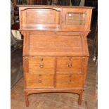 An Arts & Crafts oak bureau cabinet, 92 cm wide Lacks three quarter gallery to top.