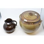 A Cornish 'Lakes' pottery jug, 8 cm high, and an Oxshott jar and cover (2)