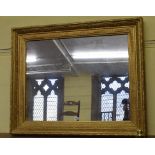 A gesso picture frame, inset a mirror, 115 cm wide