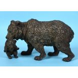 A late 19th/early 20th century Austrian cold-painted bronze group, of a bear carrying a cub by the