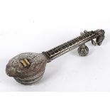 A silver coloured metal box, in the form of a sitar, decorated peacocks, and with a mythical beast