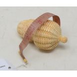 A novelty bone tape measure, in the form of a nut