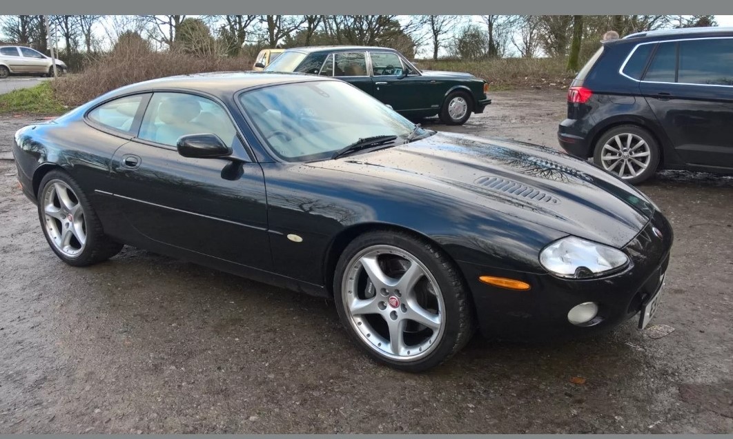 A 2002 Jaguar XKR Coupé, registration number E9 LCH, black. Introduced in 1998 the supercharged