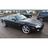 A 2002 Jaguar XKR Coupé, registration number E9 LCH, black. Introduced in 1998 the supercharged