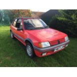 A 1989 Peugeot 205 CTI Cabriolet 1.6, red. This soft top version of the renowned 205 GTI has covered