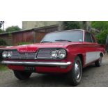 A 1962 Pontiac Tempest Le Mans V8, registration number 229 XVF, red/white. This rare American