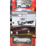 A Guiloy 1:18 die-cast model Aston Martin DB7, and seven others, all boxed (8)