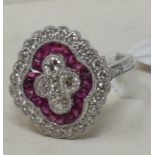A large platinum Victorian style ruby and diamond cluster ring, of shaped oval form, approx. ring