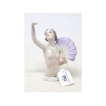 A porcelain half doll, nude lady with short hair, holding a feather fan, 15 cm high