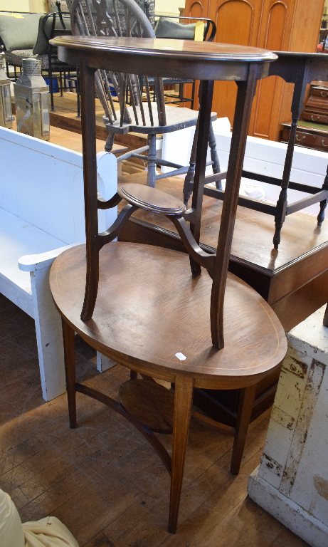 An Edwardian inlaid mahogany oval occasional table, 92 cm wide, another similar, two other tables,