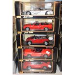 A Maisto 1:18 die-cast model McLaren F1, and four others, all boxed (5)