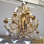 A gilt brass twelve light chandelier, fitted for electricity (needs re-wiring), 74 cm wide