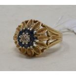 A 14ct gold, sapphire and diamond ring, in the form of a flowerhead surrounded by petals, approx.