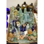 A collection of assorted coloured and clear glass bottles, and other items (qty)