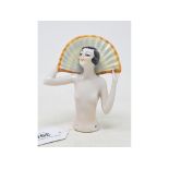 An Art Deco porcelain half doll, nude lady with open hand held behind head, 10.5 cm high