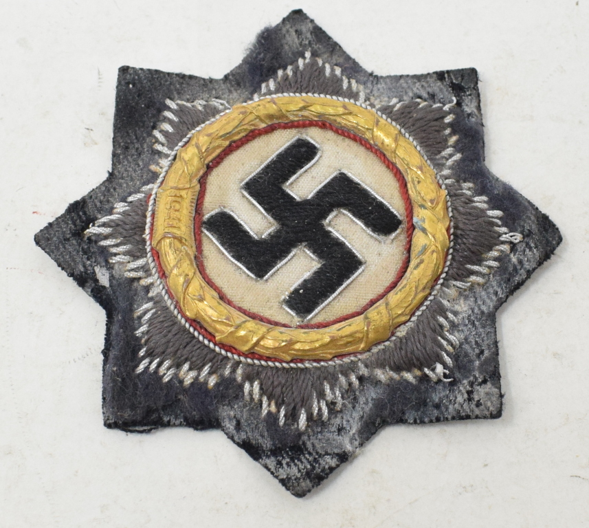 A German World War II cloth Cross in Gold, some wear