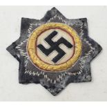 A German World War II cloth Cross in Gold, some wear