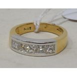 An 18ct yellow gold ring, set five princess cut diamonds in a channel setting, approx. 1.02ct,