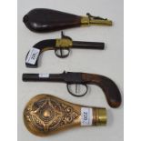 A 19th century percussion cap pistol, 18 cm, another pistol, a shot flask and a powder flask (4)
