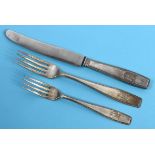 An Adolf Hitler formal pattern silver coloured metal table knife, with a steel blade, with a