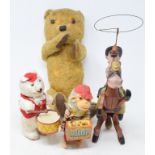 A Max Carl clockwork toy, 14 cm high, two other clockwork toys, a Morse Code game, and a teddy