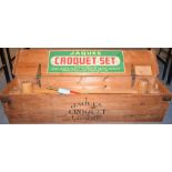 A Jaques croquet set, for four players, complete in original wooden case, 110 cm wide