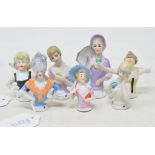 Seven porcelain half dolls, the tallest 8 cm (7)