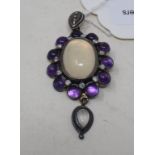 A 9ct gold, silver, amethyst, diamond and moonstone pendant