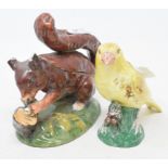 A 19th century porcelain canary, 9.5 cm high, and a Victorian porcelain box and cover, in the form