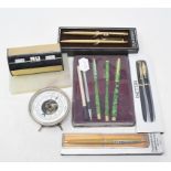 A Conway Stewart pen and pencil set, cased, other assorted pens, two perpetual calendars and other