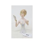 A bisque half doll, lady with a blonde wig wearing a white strapless dress, holding a mirror,
