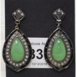 A pair of Art Deco style earrings, set pear drop cabochon, jade, surrounded by diamonds and onyx,