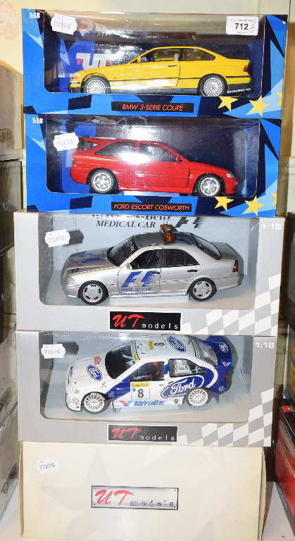 A UT Models 1:18 die-cast model Ford Escort Cosworth, and four others, all boxed (5)
