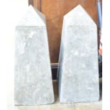 A pair of composition obelisks, 75 cm high