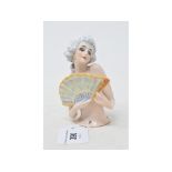 A porcelain half doll, lady with white hair holding a fan, impressed no. 6903 to back, 10.5 cm high