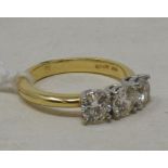 An 18ct yellow gold and three stone diamond ring, diamonds approx. 1.52ct, approx. ring size N½