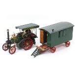 A DRM live steam wagon, Bertie, in green livery, 32 cm long, and a showman's wagon with a well